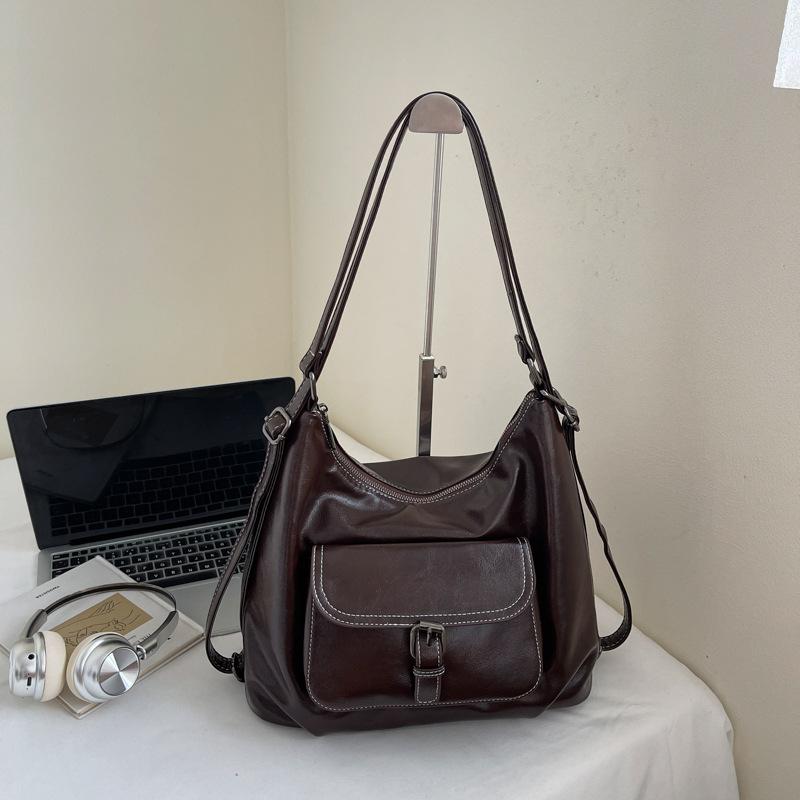 Casual large capacity retro bag women 2025 new versatile shoulder bag double shoulder backpack commuter bucket bag