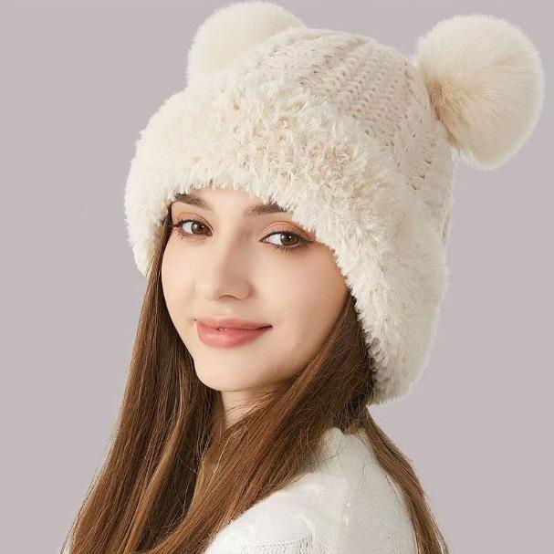 Niedliche Damen Wintermütze mit Bommel aus Wolle, Plüschrand und Ohrenschutz