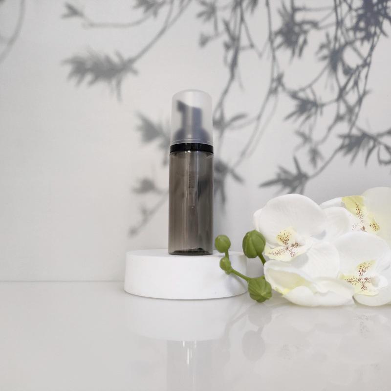 Available 60ml Transparent Black Foam Mousse Bottle for Face Wash and Travel-friendly Cosmetic Packaging.