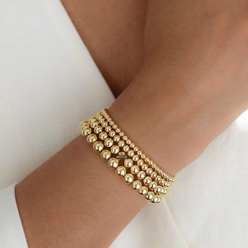 

Versatile Round Bead Hematite Gold-Plated Elastic Bracelet: European & American Beach Style with Color Retention 3MM Gold