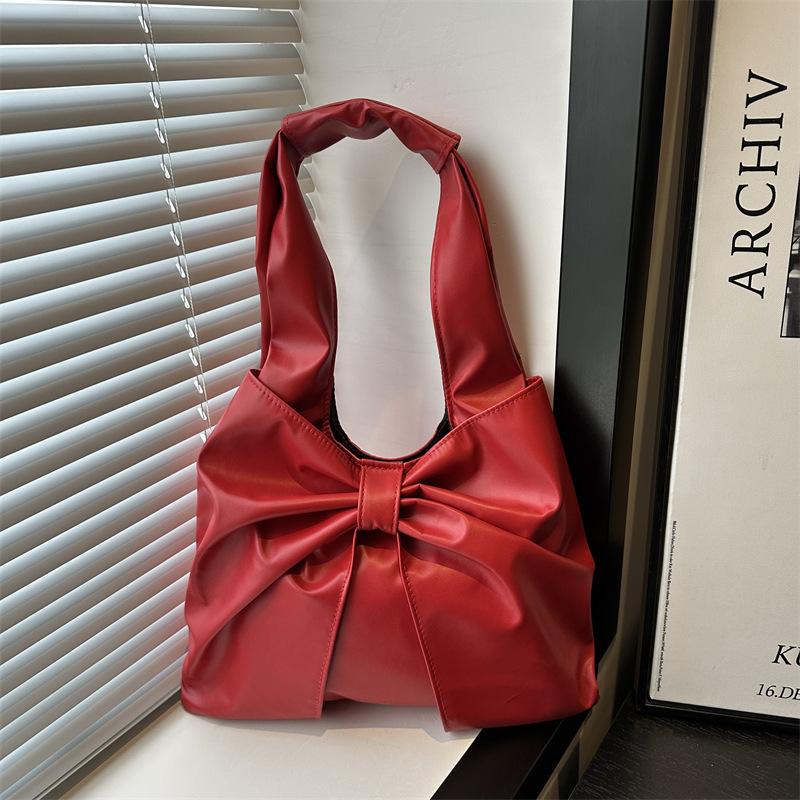 Korean version of casual underarm women's bag 2025 new simple bow design sense tote bag simple portable shoulder bag