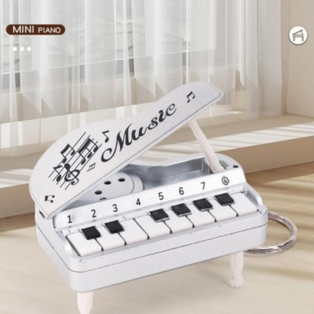 Foldable piano keyring capable of playing melodies, cute mini piano keyring серебряный