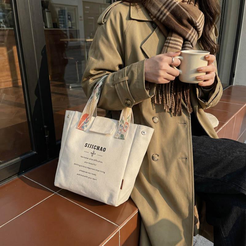 Casual alphabet canvas bag Women's large-capacity portable tote bag Bento bag Student lunch box bag Hand carry storage bag