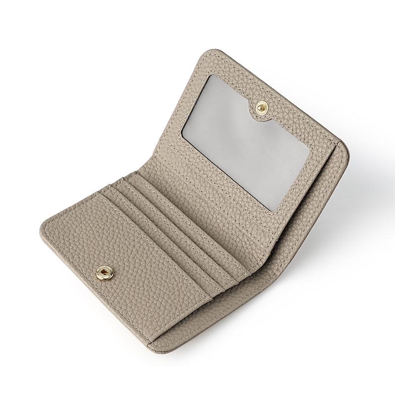 

Женский кошелек из натуральной коровьей кожи 2024 года — небольшой, портативный, с блокировкой RFID, отделениями для нескольких карт и монетницей на кнопке