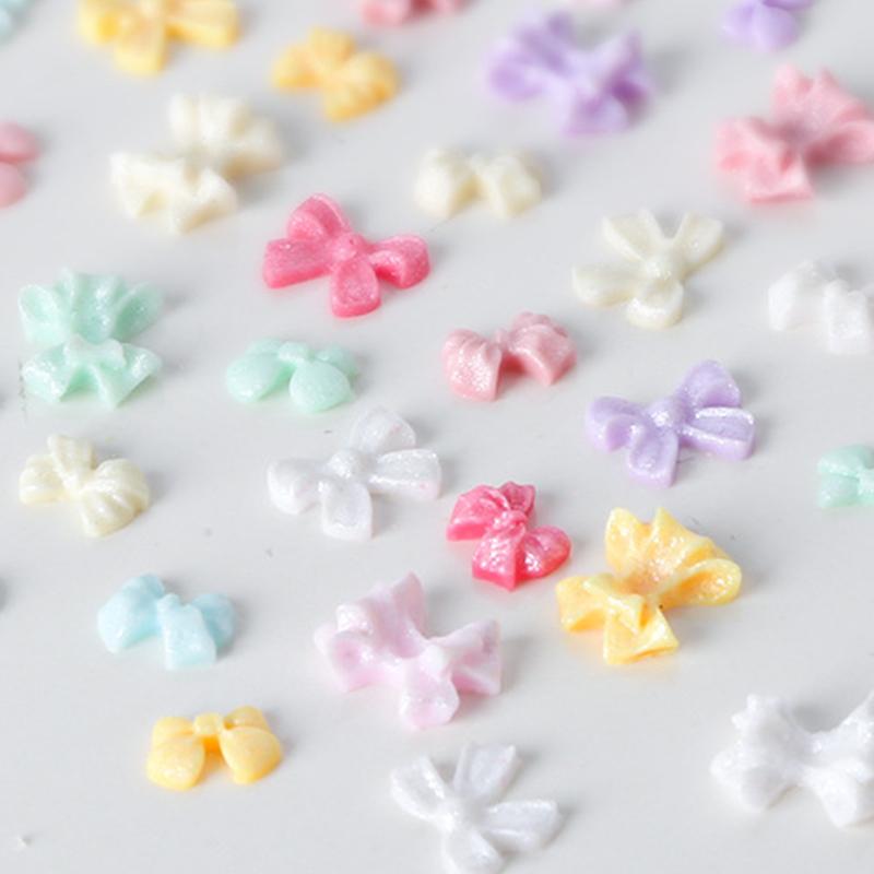 100Pcs/Bag Mini Bow 3D Cute Nail Art Decorations Bowknot Ornament Shiny Nail Charm Jewelry Diy Resin Nail Accessories Flat Back