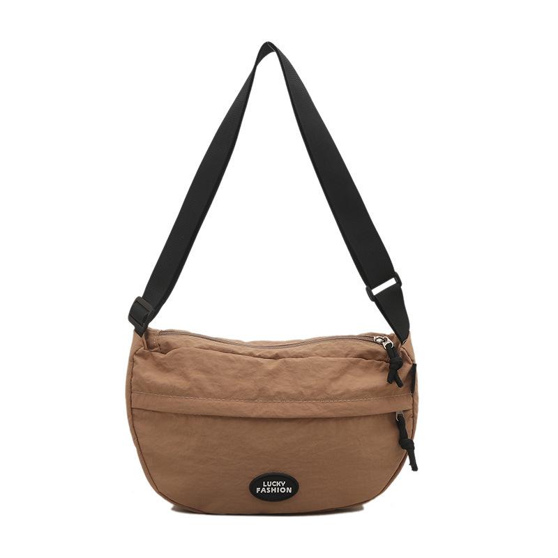 

Japanese casual commuter messenger bag women s 2025 new solid color dumpling bag fashionable college student women s shoulder bag хаки