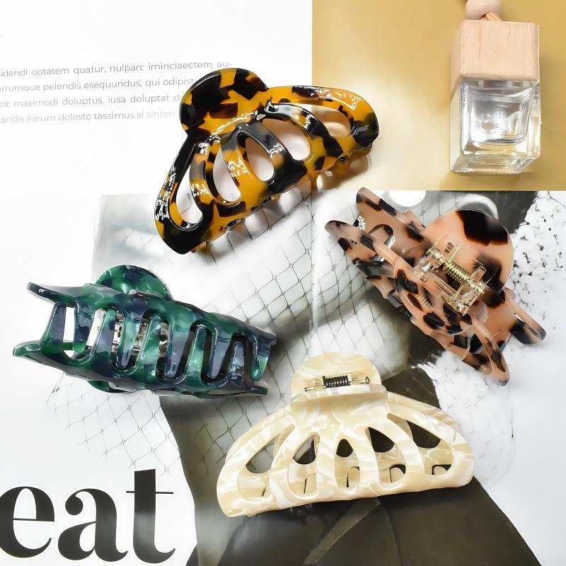 Cross Shark Claw Clip: Elegant Large Acetate Hair Accessory for Women’s Bun or Ponytail.
