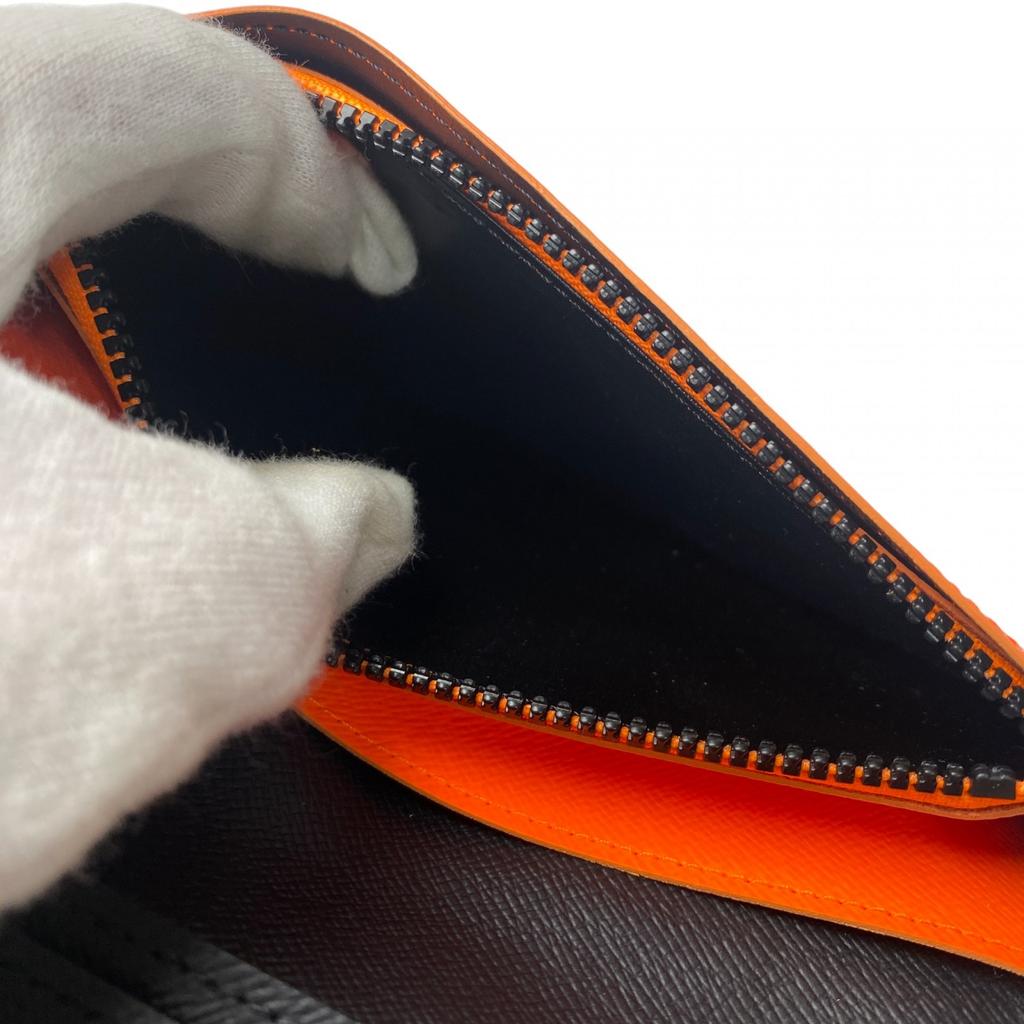 Używany portfel LOUIS VUITTON Seria Brązowo/Pomarańczowa PVC męski