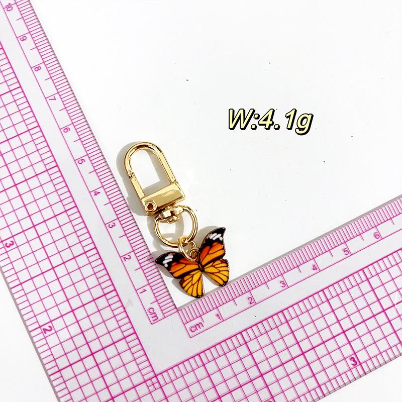 Kreativer Mini-Schmetterling Schlüsselanhänger Anhänger - Stilvolles Accessoire für Damenhandtaschen & Autoketten