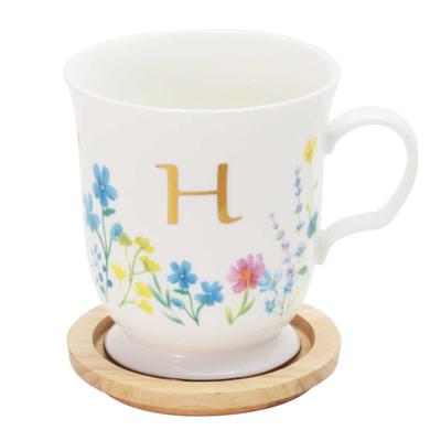 This Elegant 350ml Mug Features a Delicate Floral Design and a Gold Initial It Comes with a Coaster That Doubles As a Lid or Small It Also Comes In a