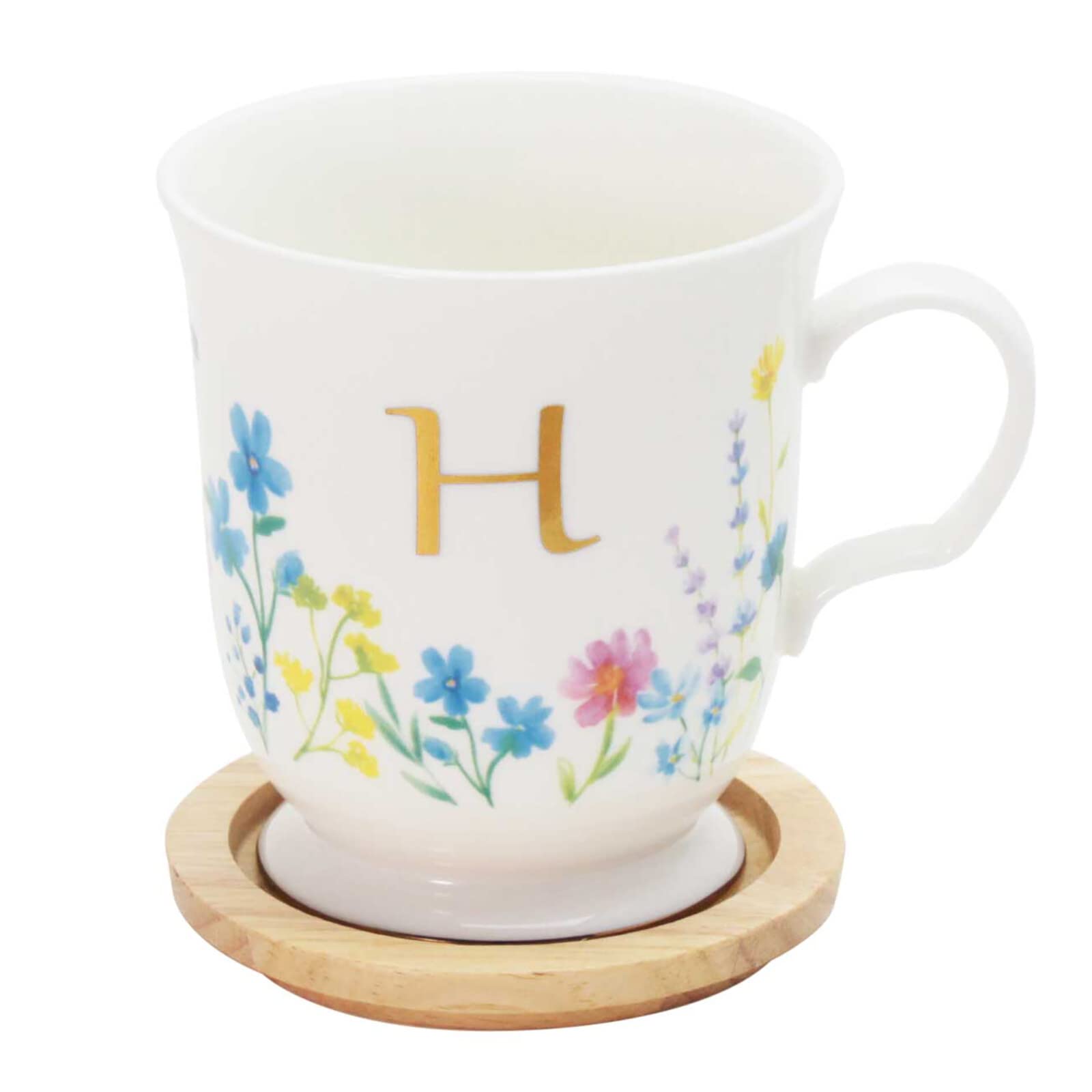 

This elegant 350ml mug features a delicate floral design and a gold initial It comes with a coaster that doubles as a lid or small It also comes in a