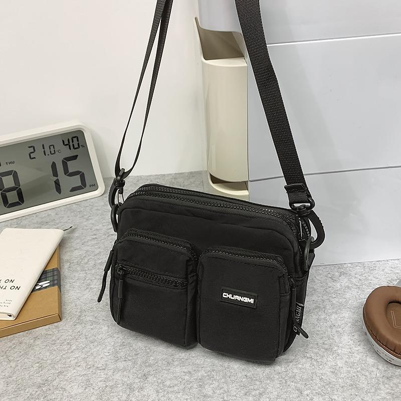 Outdoor leisure multi-pocket canvas messenger bag women's and men's simple travel nylon single shoulder small square bag