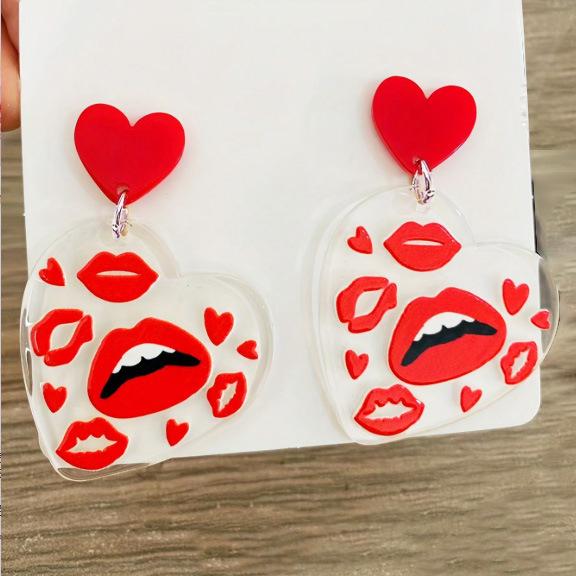A pair of Valentine's Day acrylic red heart-shaped earrings, sweet personality red lips, niche trend women's earrings.