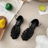 2025 Sommer flache Römersandalen gewebt durchbrochen Retro runde Zehenpartie Schweinekäfigschuhe Damen Ein-Wort Schnallenriemen Taschenkopf Sandalen