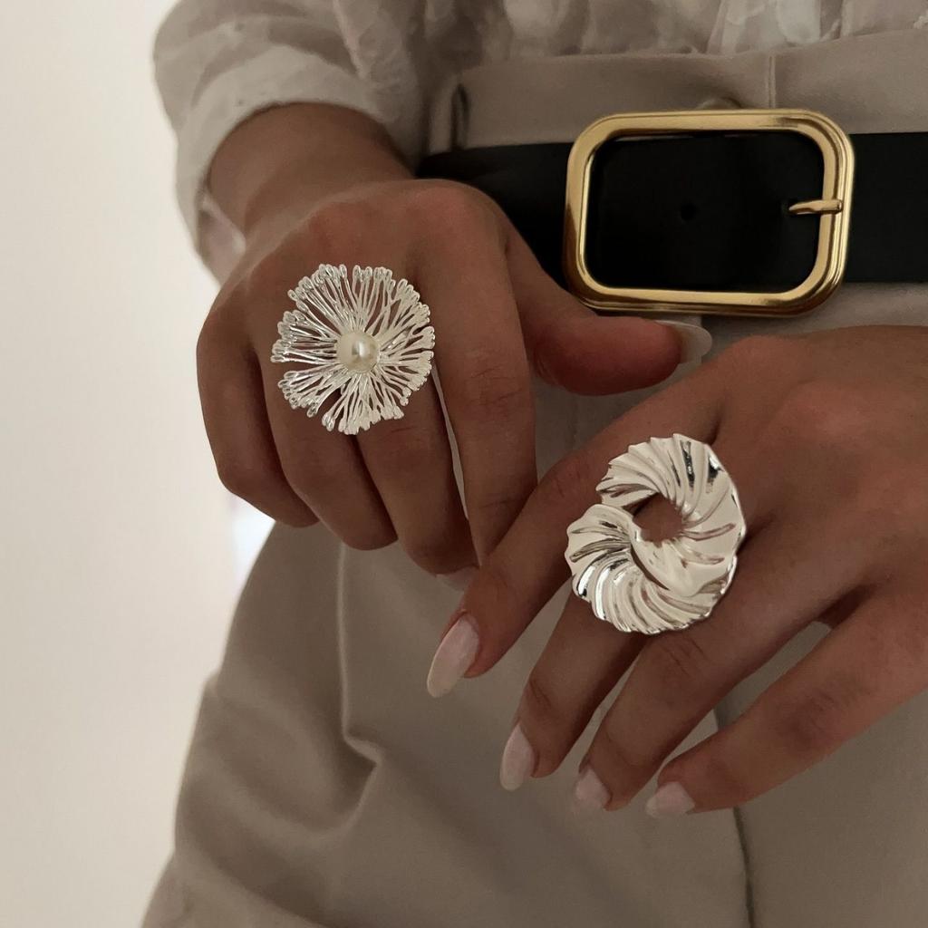 Hollow flower ring European and American niche design sense irregular spiral imitation pearl open ring jewelry women