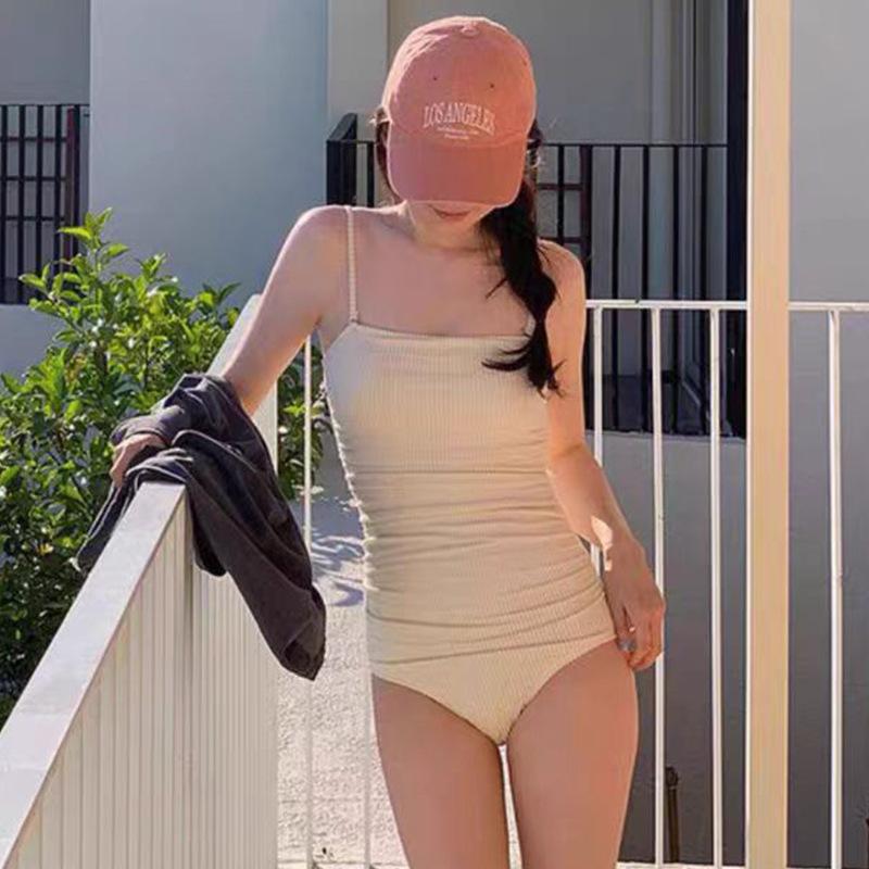 Source one-piece triangular swimsuit women's simple solid color belly cover, thin and conservative small chest vacation swimsuit