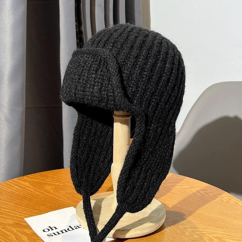 Autumn and winter pink knitted wool hat women's lace-up ear protectors flying hat warm versatile face small ski Lei Feng hat