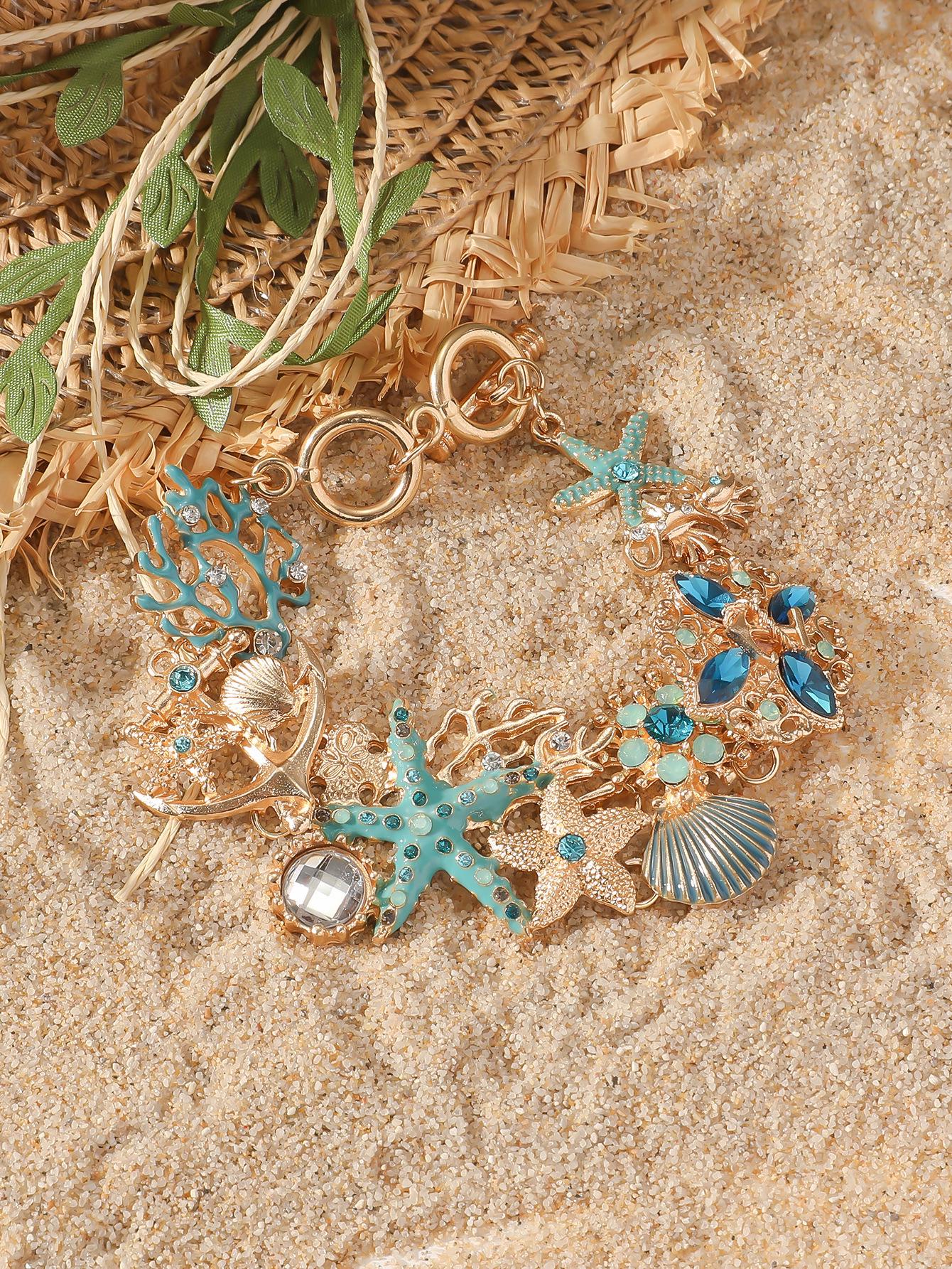 

Богемный браслет-шарм «Океан» с элементами морской звезды, коралла и ракушек коралловый/синий