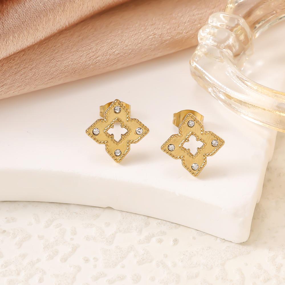 Elegant Titanium Steel Clover Jewelry Set - Necklace, Bracelet, and Earrings in Four-Leaf Design with Micro-Inlaid Details for Women.