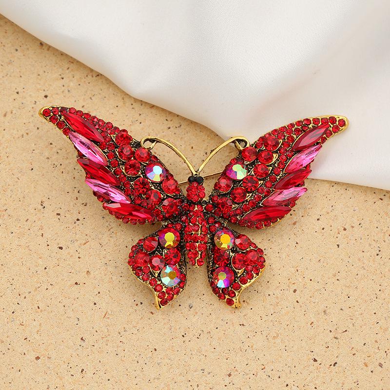 

High-End European & American Butterfly Brooch: Rhinestone Pin for Women s Clothing, Corsage, Scarf Buckle, and Insect Jewelry Accessory. червоний