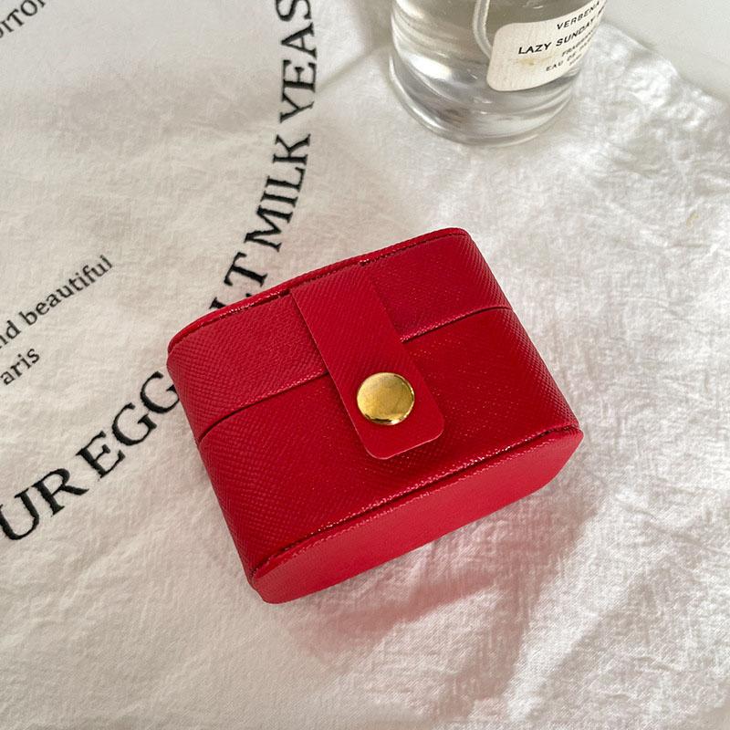 

Міні-портативна невелика сумка для зберігання коштовностей Дорожня проста шкіряна каблучка Намисто Сережки Коробка для зберігання Органайзер Дисплей Подарункова коробка червоний