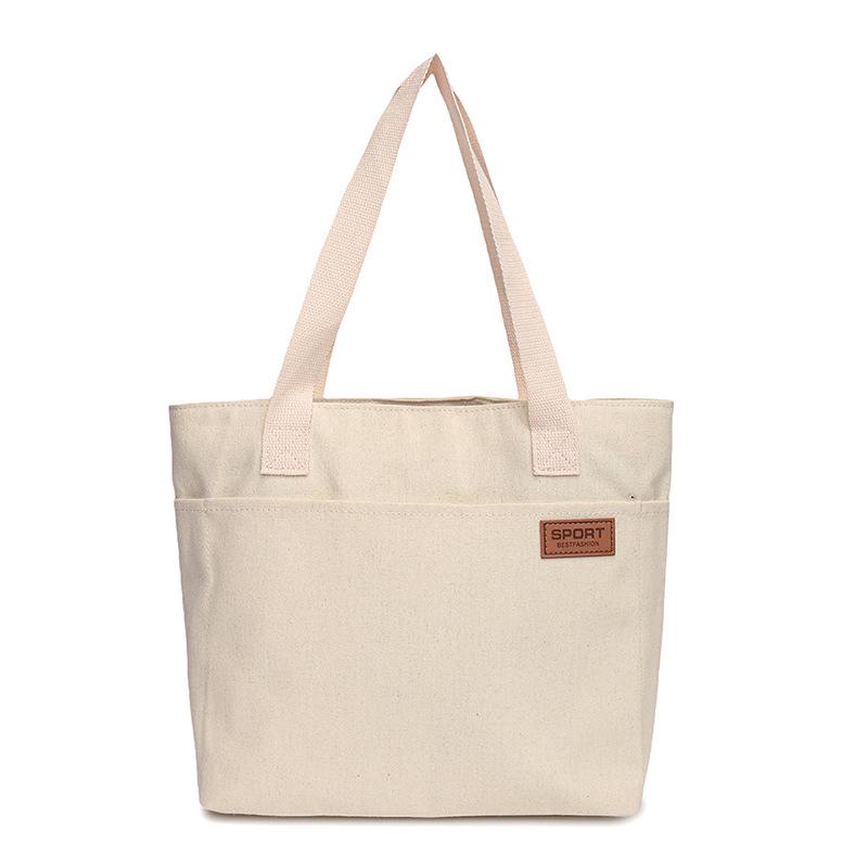 Women's Versatile Canvas Tote - Lightweight, Large Capacity, Single Shoulder or Handheld Bag for Students and Commuters.
