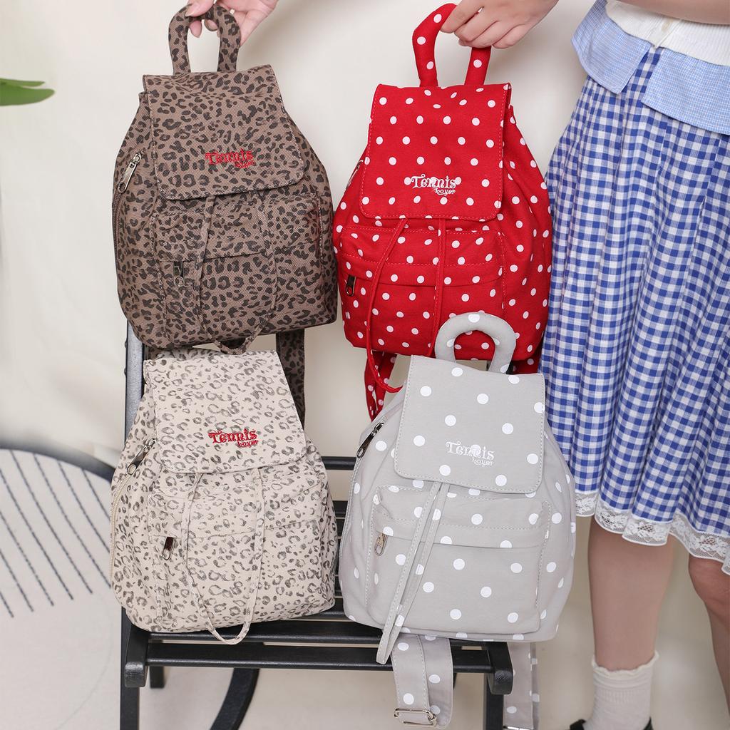 A Canvas Backpack with Polka Dots and A High Level of Appearance