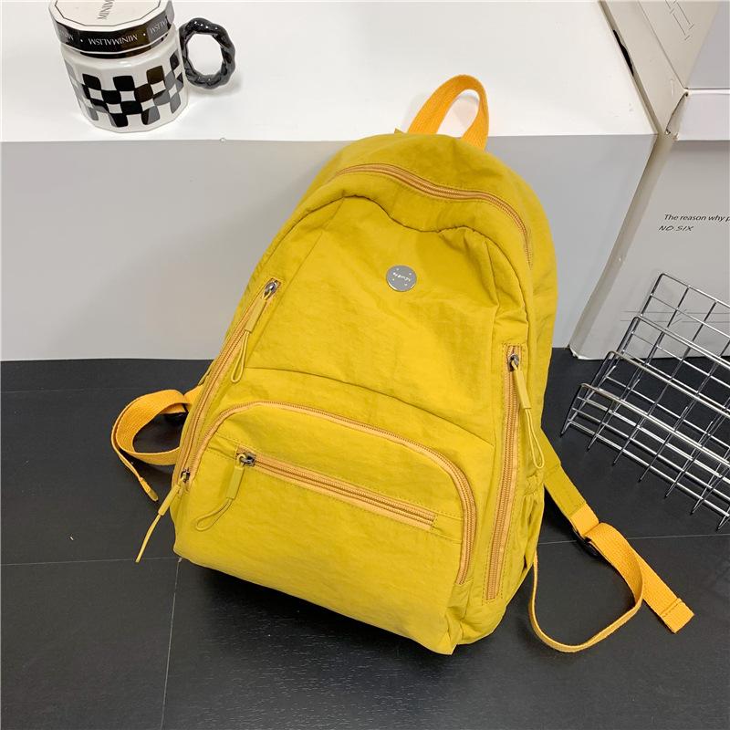 The Backpack Is Lightweight, Casual, and Has A Large Capacity. It Is A Simple and Fashionable Student Schoolbag