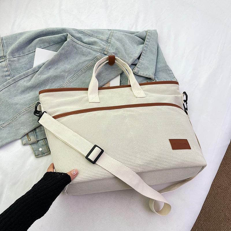 

Popular large-capacity niche design 2025 spring new foreign-style casual shoulder bag simple tote hand carry big bag