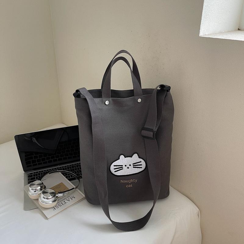 

Canvas bag women s shoulder lazy wind literary and artistic Japanese and Korean niche simple large-capacity letter student class tote bag
