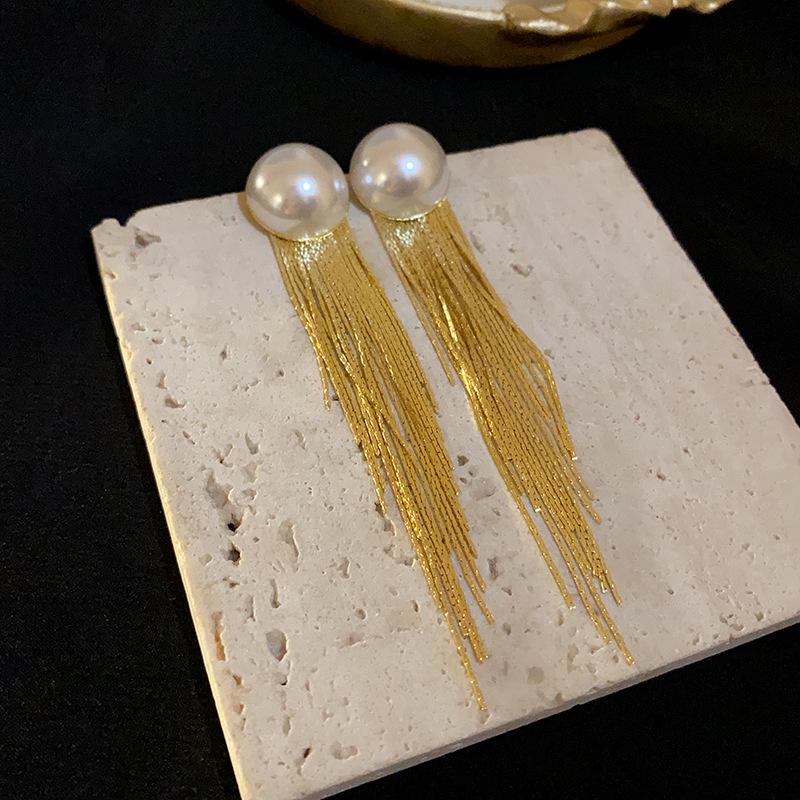 

Silver needle semi-round pearl fringed earrings European and American niche long earrings personalized fashion metal style earrings women