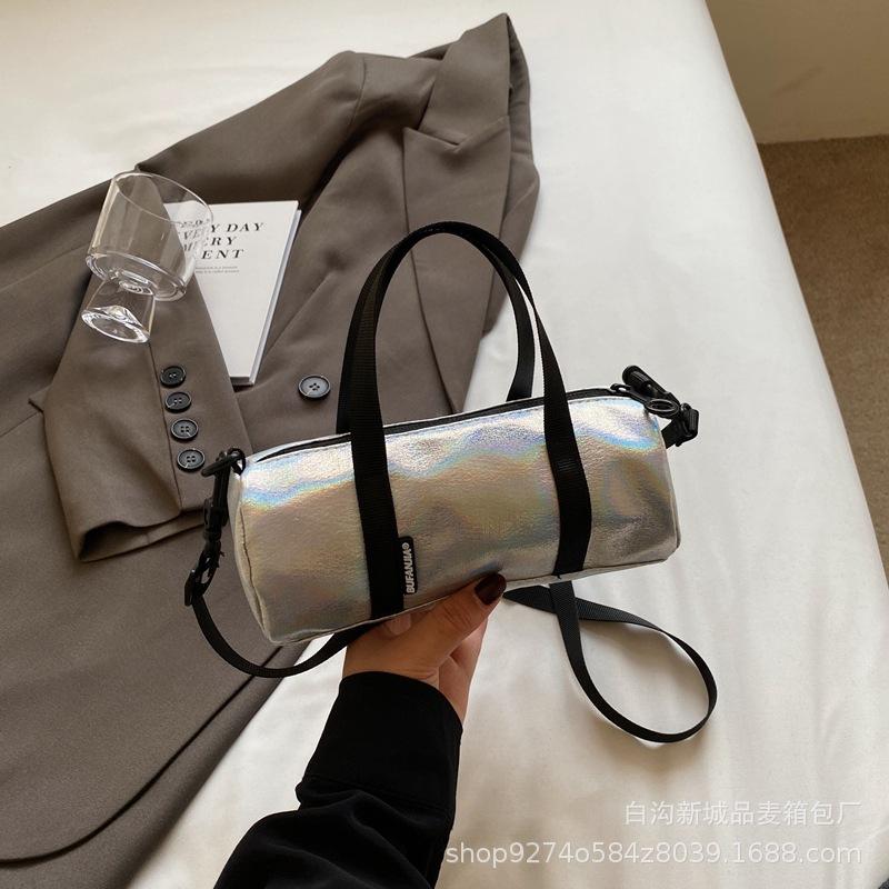 

Explosive hand-held colorful small bag women s bag 2025 new trendy temperament shoulder bag foreign style crossbody cylinder bag серебряный