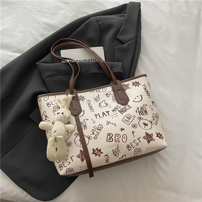 Printed fashion commuting large capacity new personalized pendant autumn popular casual shoulder tote bag