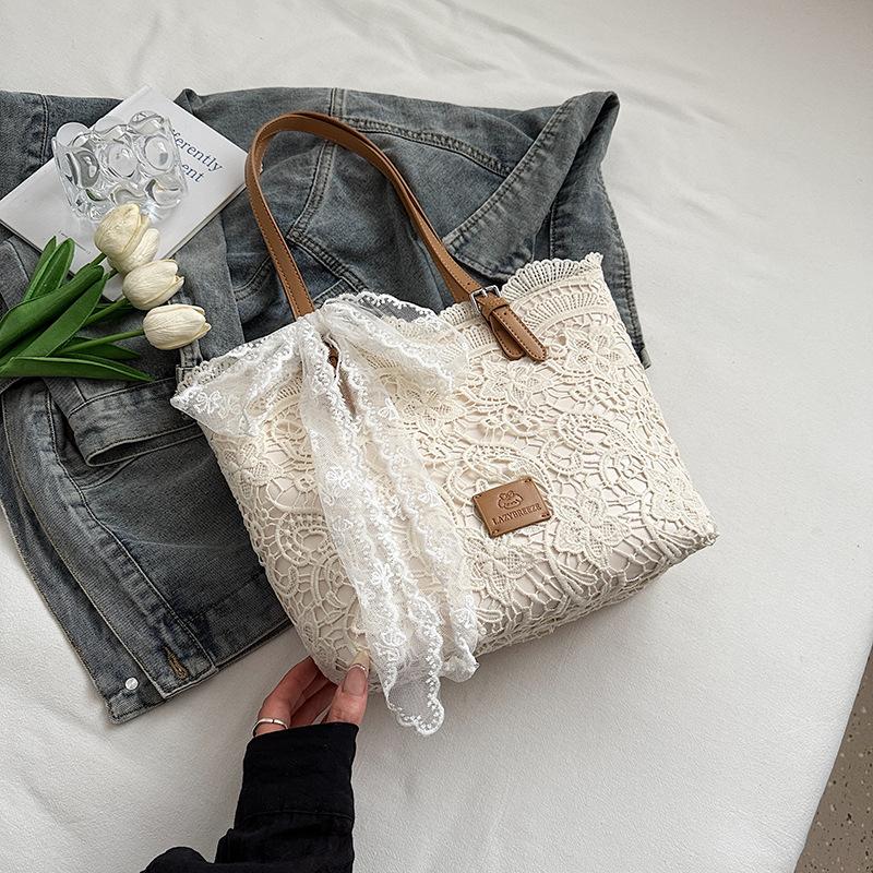 

Niche Korean version of large-capacity woven bag tote bag summer new hollow lazy wind shoulder armpit bag beach bag