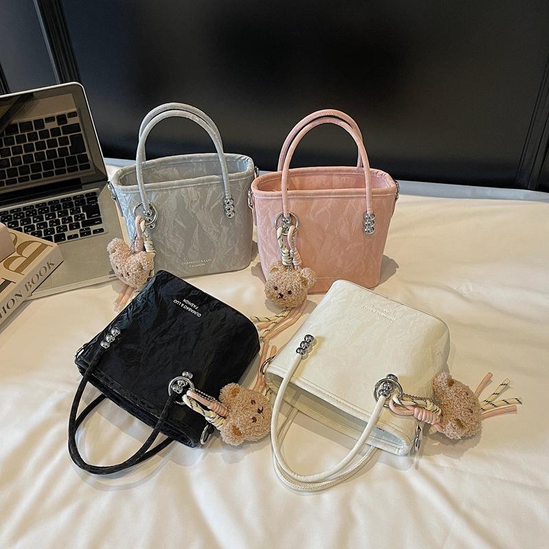 Solid color casual sweet bucket bag women's new solid color fashionable trendy messenger bag commuter simple handbag