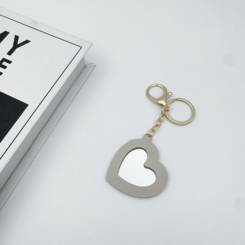 Přenosné pouzdro na rtěnku ve tvaru srdce s ochrannou kůží a roztomilou klíčenkou s přívěskem