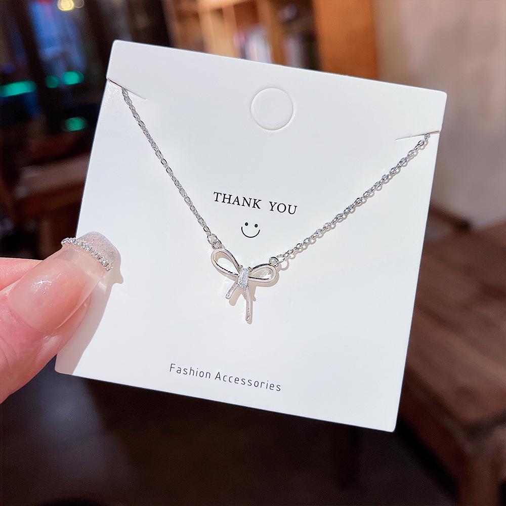 

Fresh Rhinestone Bow Pendant Clavicle Chain: Sweet Titanium Steel Necklace for Lovely Girls