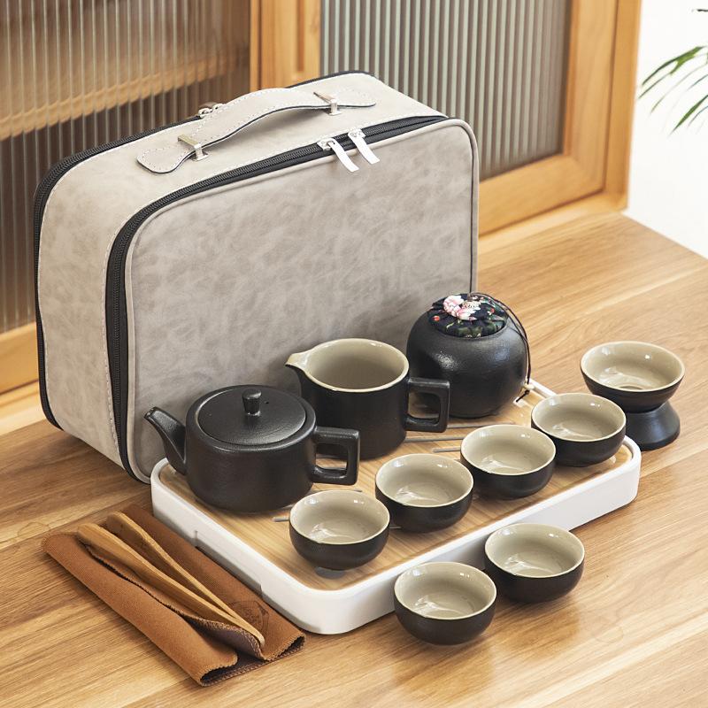 Black pottery travel kung fu tea set portable business gift set creative ceramic cooling pot set