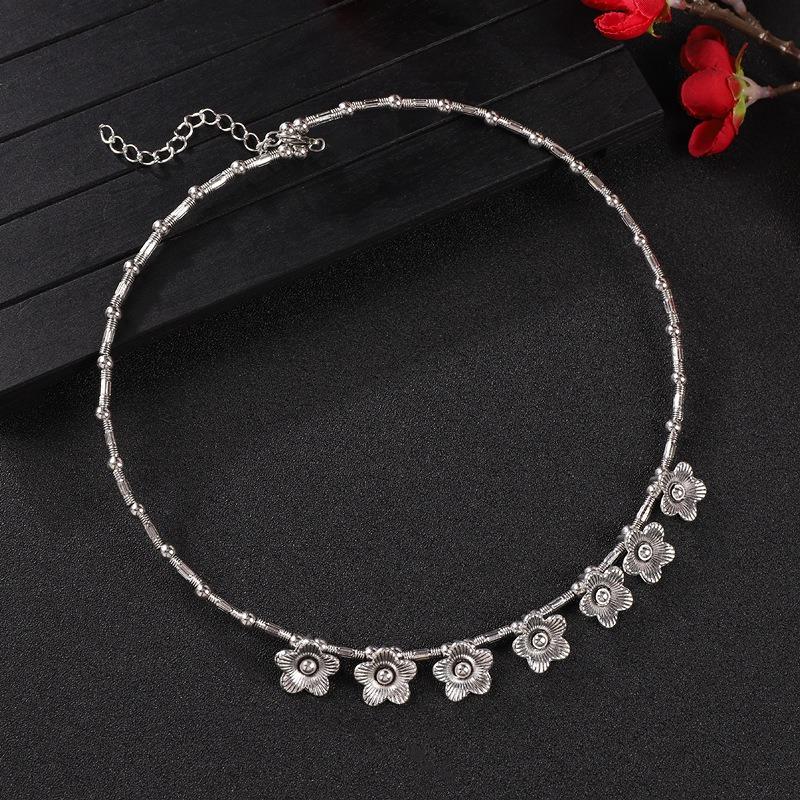 Vintage tassel collar hollow flower seedling silver pendant necklace niche personality collarbone chain women
