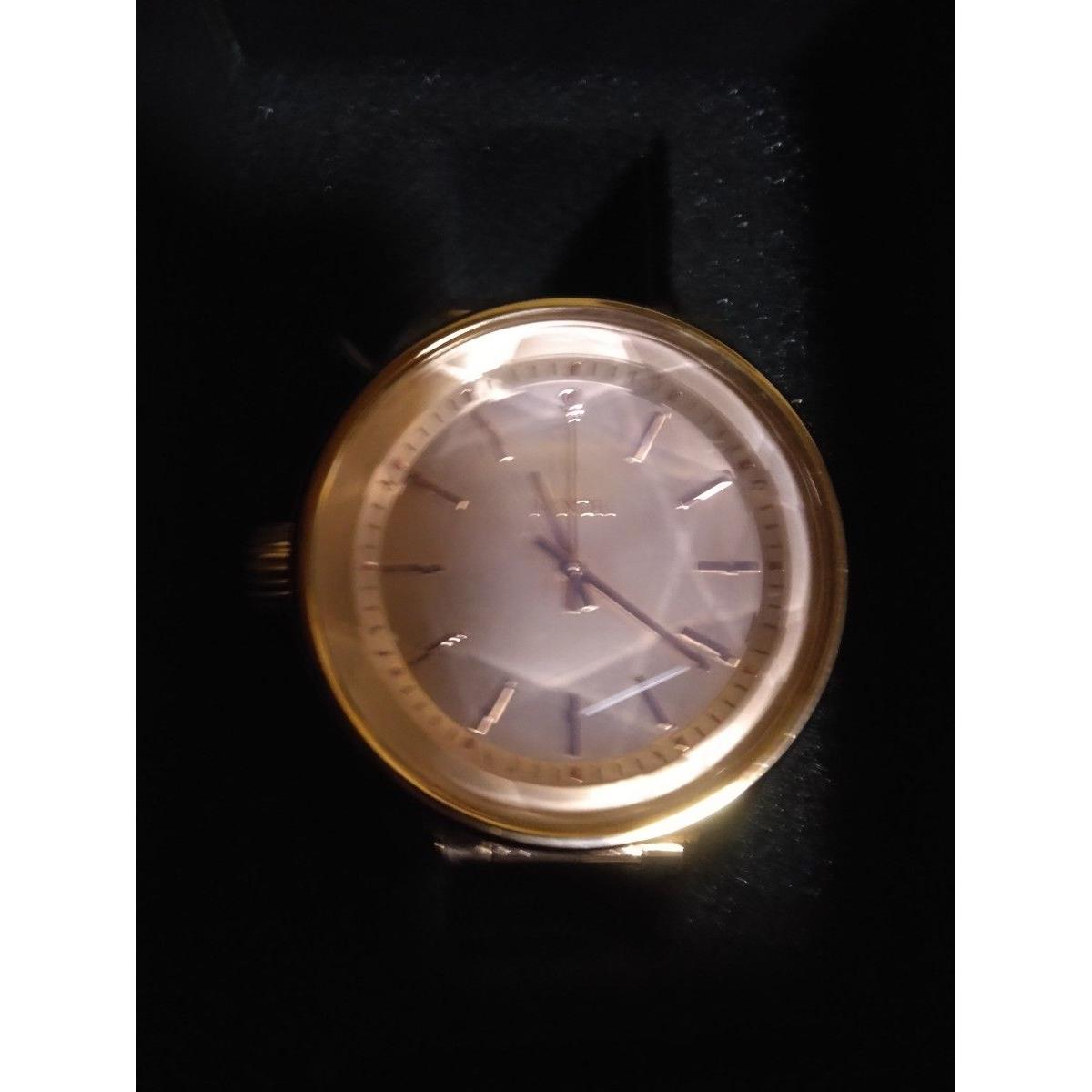 Used Beautiful ladies watch Nixon pink gold color
