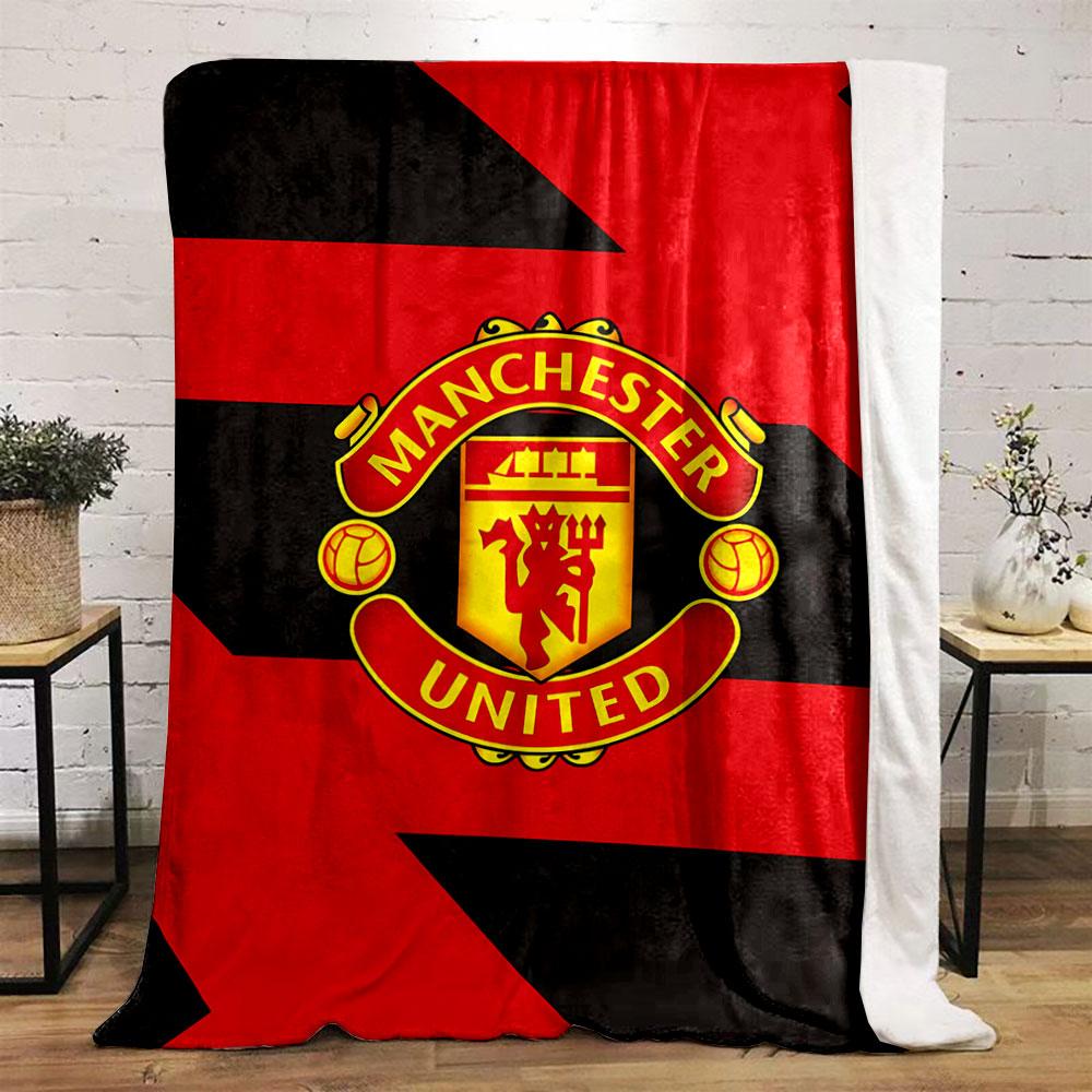 Diagonal red and black zigzag pattern with a central Manchester United logo. for all seasons blanket lunch break throw gift