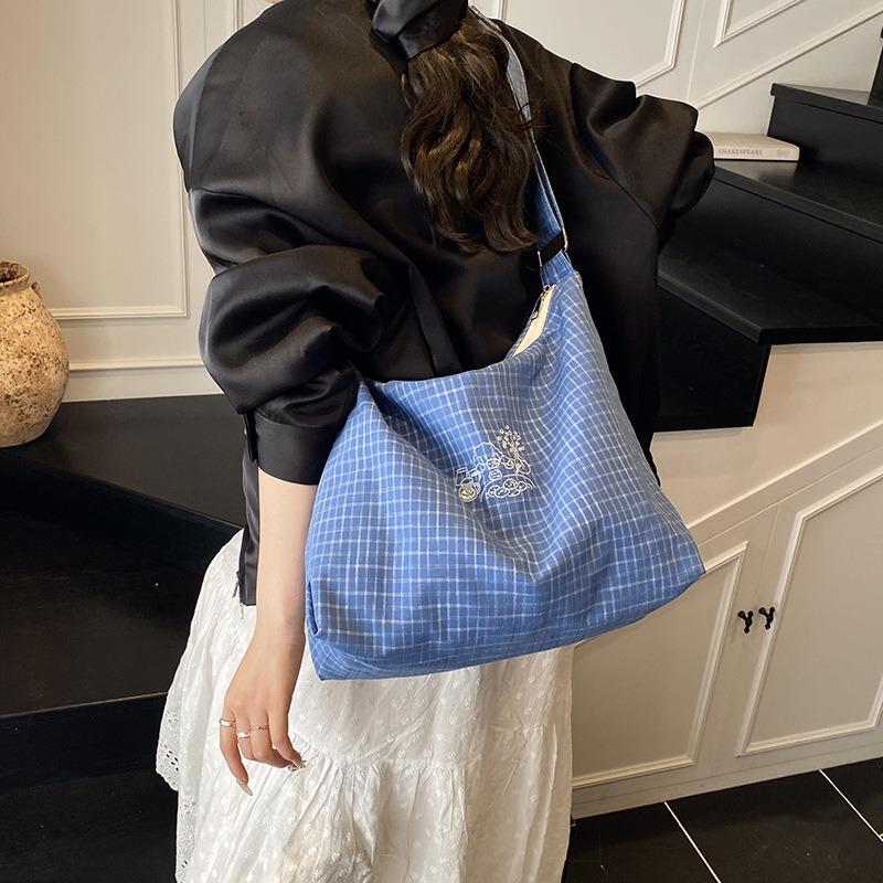 Simple canvas bucket bag women's spring and summer new fashionable versatile plaid large-capacity shoulder bag