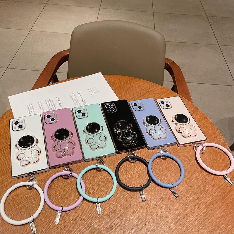 Astronaut bracket is suitable for Apple 17 mobile phone case electroplating all-inclusive soft case iPhone16 folding bracket with bracelet.