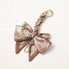 Elegant Hand-Woven Scarf Chain with Bow Decoration Pendant for Bag Strap Modification.