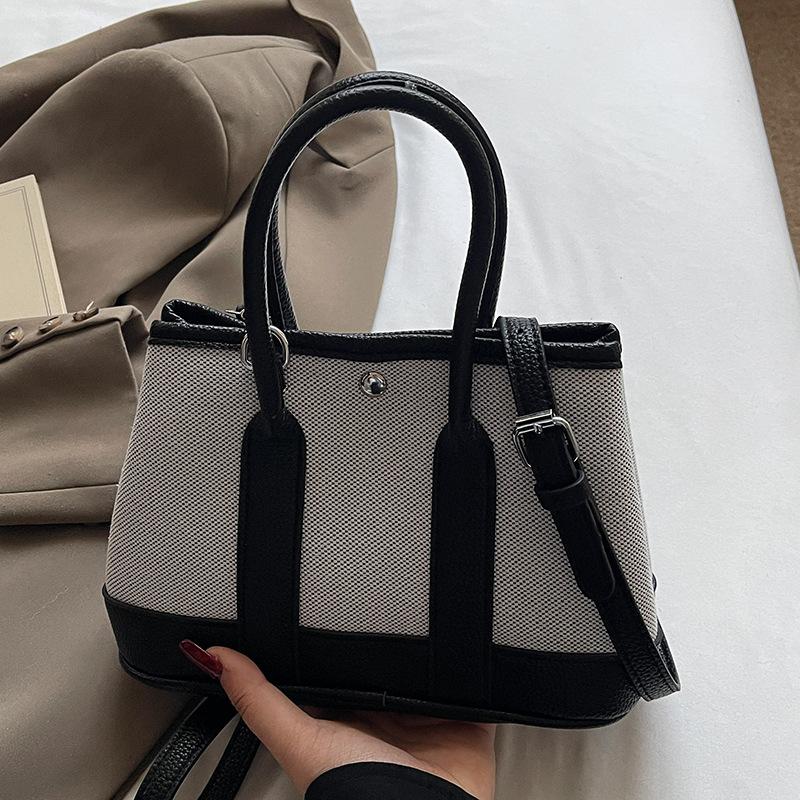 Wholesale Korean version of casual niche contrasting color portable bucket bag commuting versatile simple personality messenger women's bag