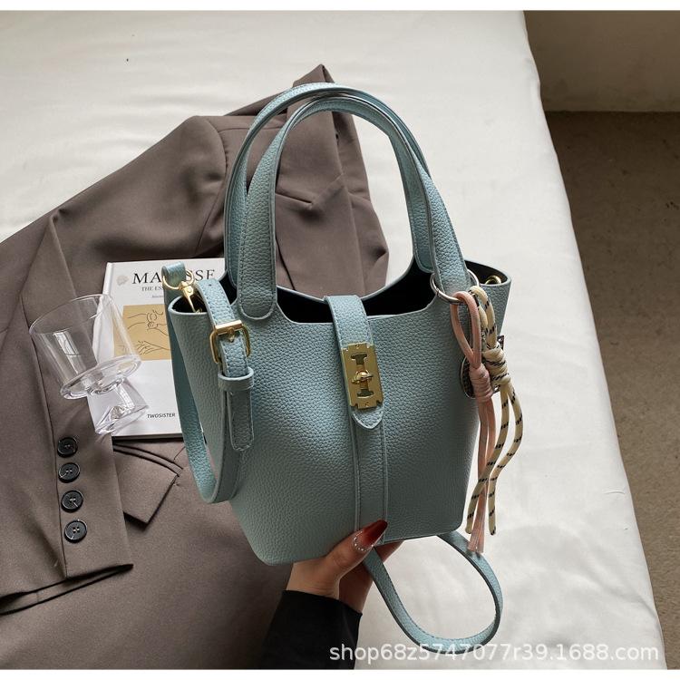

Small bag women s spring simple hand carrying bucket bag casual new commuter to work shoulder messenger bag Korean version 2025