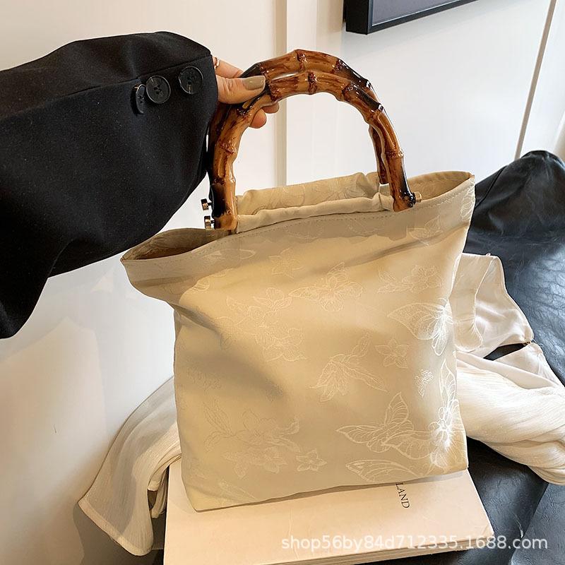 

Высококлассная нишевая сумка женская 2025 весна и лето новая Xiaoxiangfeng деревянная ручка портативная сумка-ведро