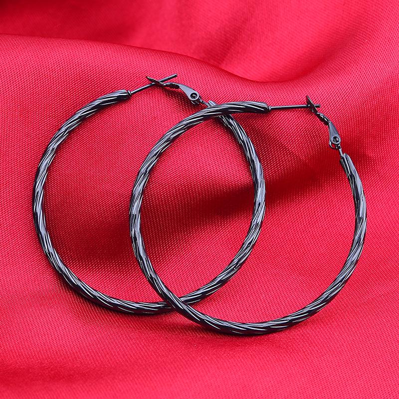 Boucles d'oreilles créoles torsadées en acier titane tendance européen et américain pour femmes - Acier inoxydable style boîte de nuit