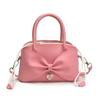 Niche bow small bag women's new hand bucket bag spring and summer retro shoulder messenger bag