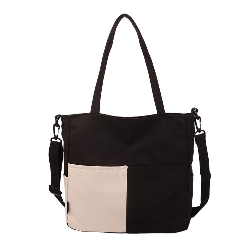 

Жіноча полотняна сумка контрастного кольору великої місткості через плече чорний